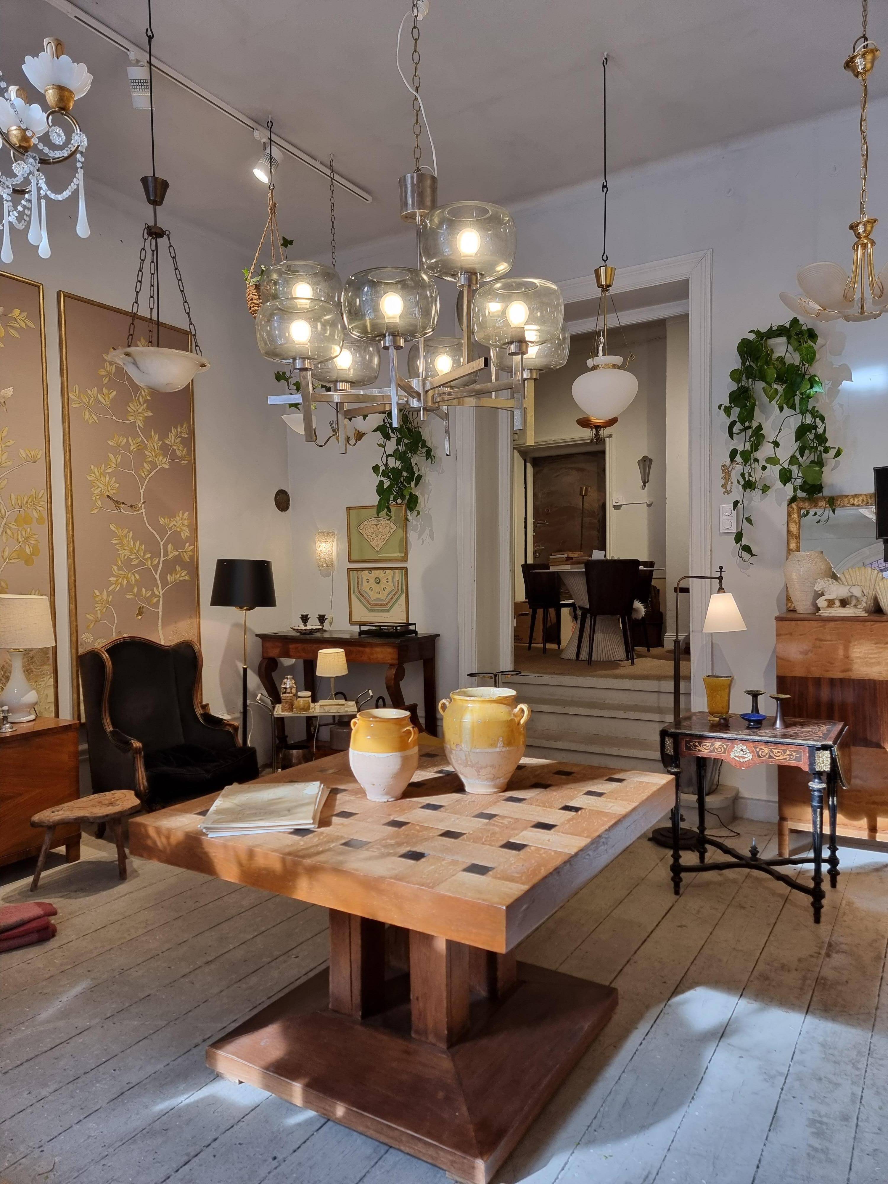 Timeless modern Scandinavian / mid-century chandelier in chrome and smoked glass.