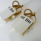 Pair of spot wall lamps adjustable design in white metal and brass. Year 80
