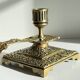 Patterned solid bronze hand candle holder