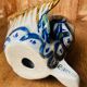 Blue ceramic zoomorphic vase in the shape of a poison.