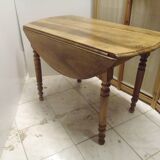 ﻿Round shutter table in solid walnut