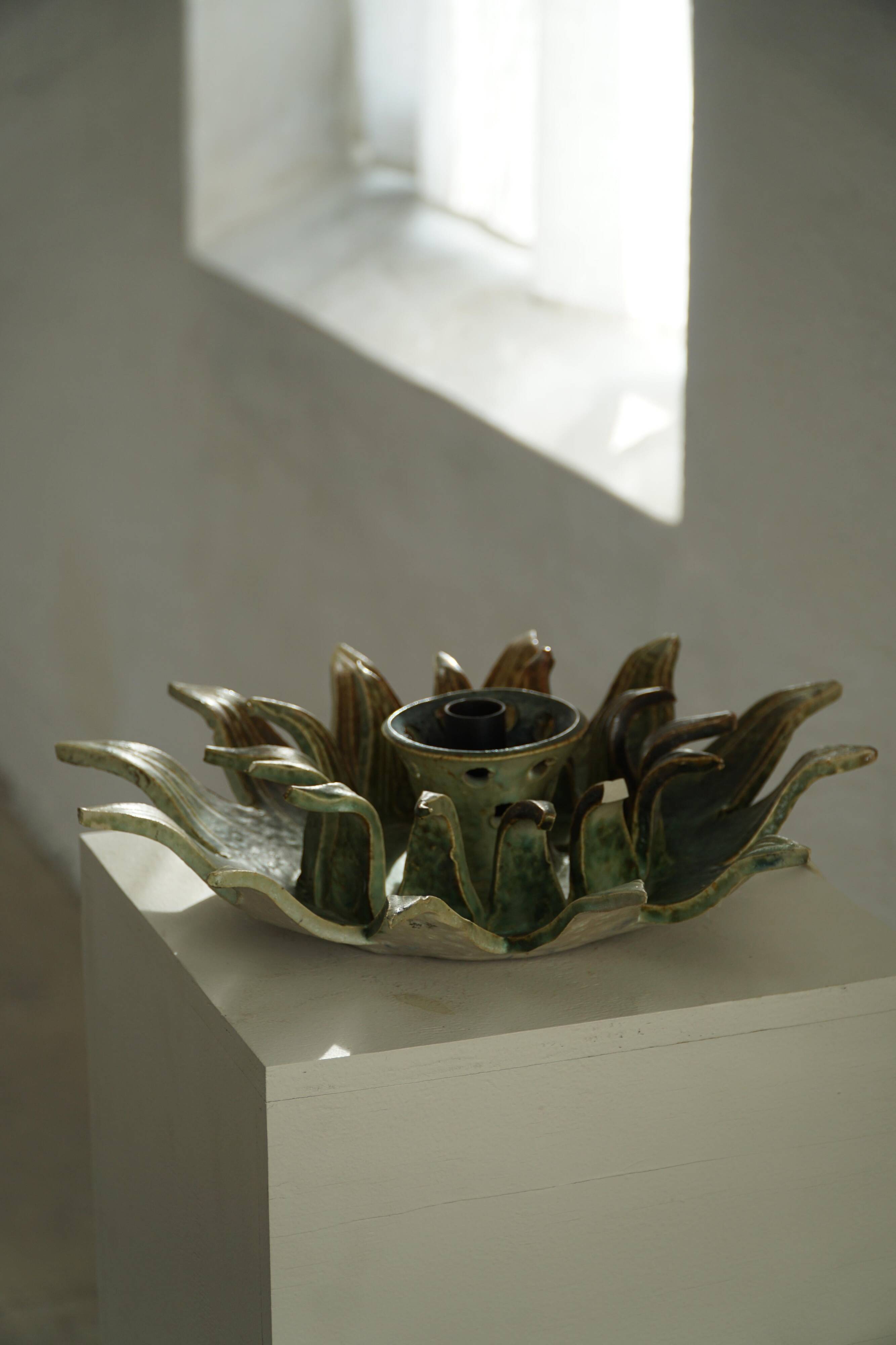 Wall lamp or decorative wall sculpture in ceramic in the shape of a sun, mid-20th century, 1960.