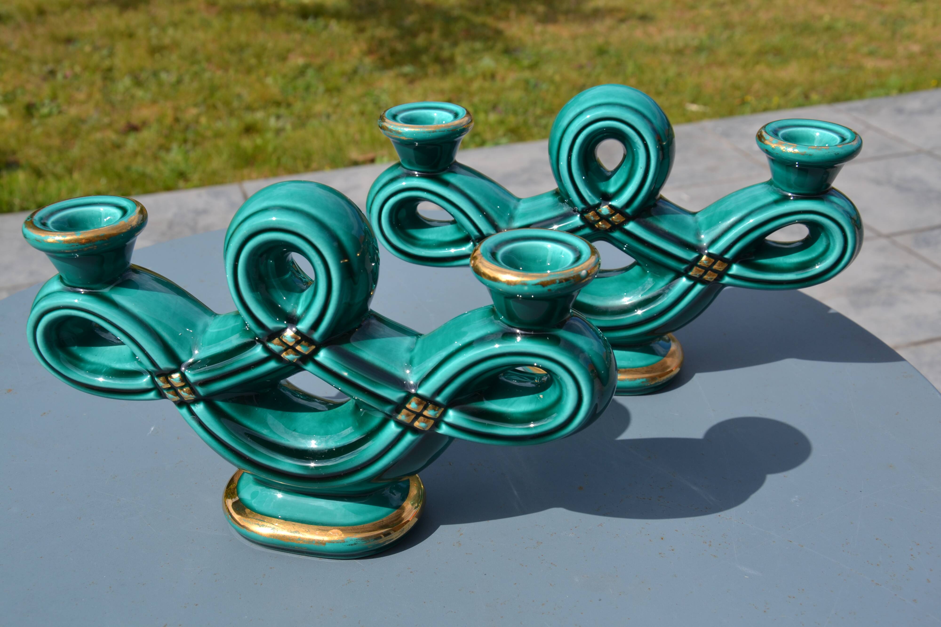 Two green ceramic candlesticks from the 1930s-1940s.