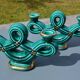 Two green ceramic candlesticks from the 1930s-1940s.