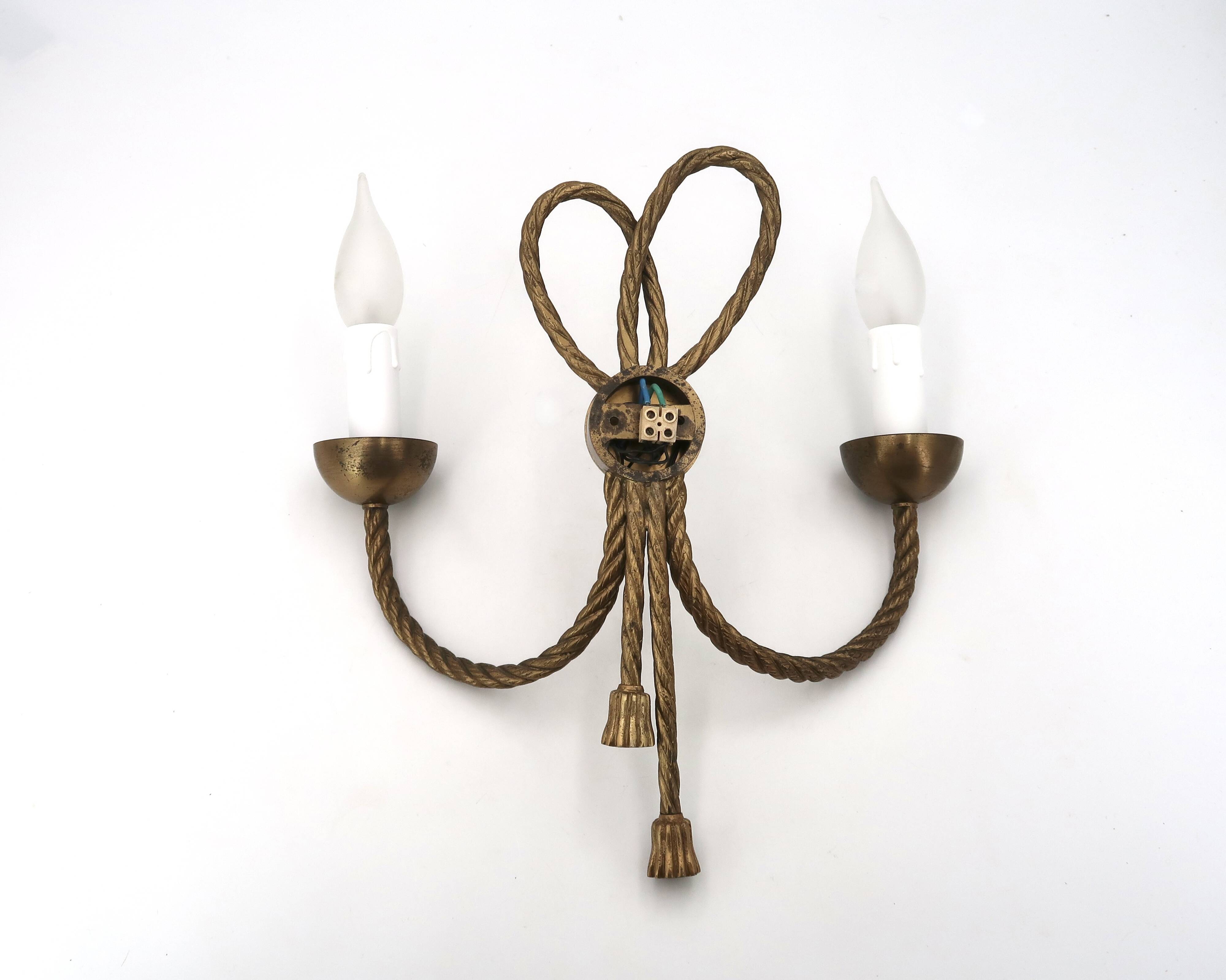 Golden wall lamp with two arms, decorated with a twisted rope bow, 1950s.