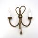 Golden wall lamp with two arms, decorated with a twisted rope bow, 1950s.