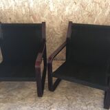 Pair of vintage armchairs in curved wood with suspended seat circa 1970-80.