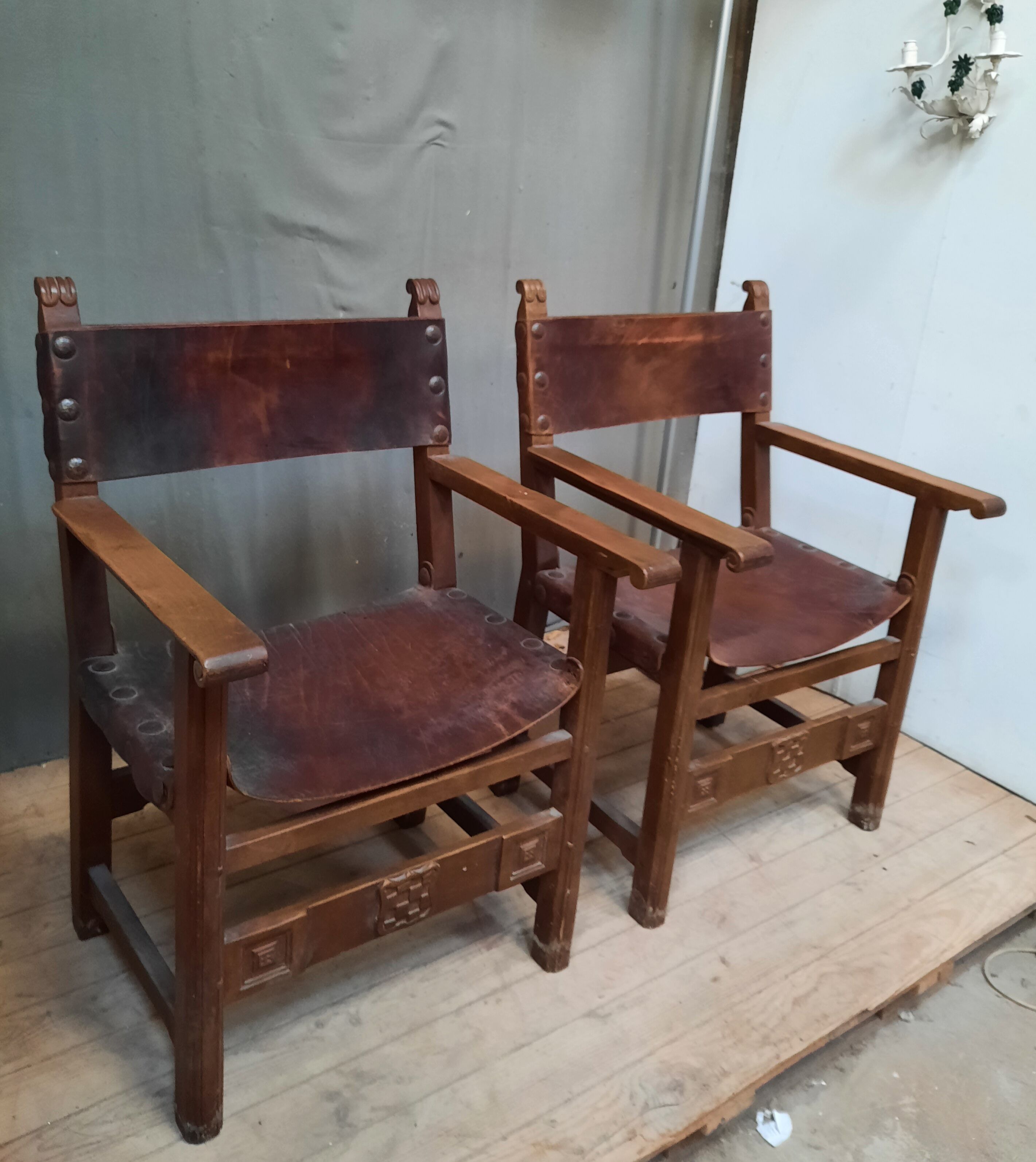 Pair of medieval leather style armchairs