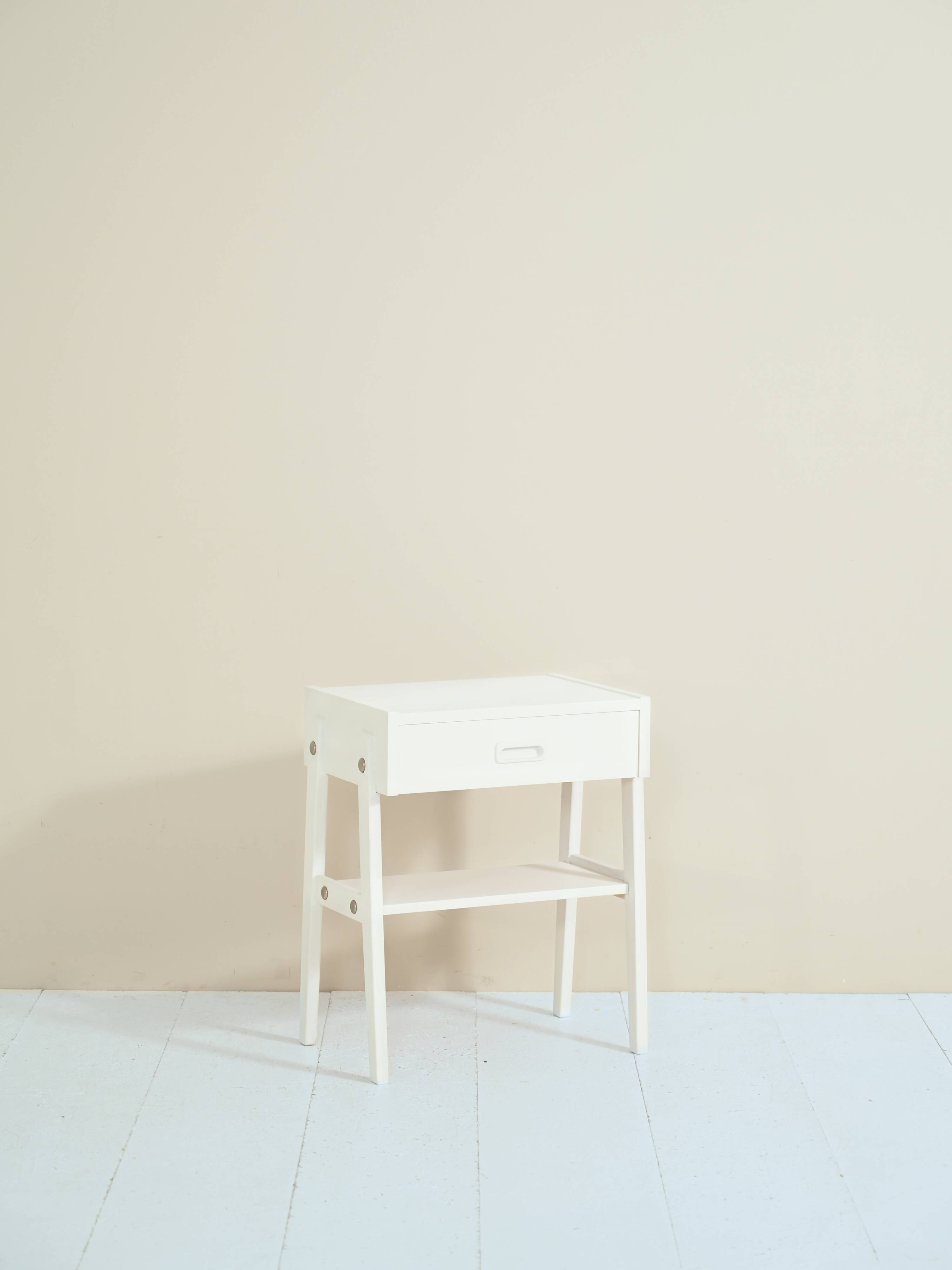Scandinavian bedside table painted in white