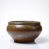 Vintage glazed stoneware bowl or planter in rustic wabi-sabi style.