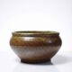 Vintage glazed stoneware bowl or planter in rustic wabi-sabi style.