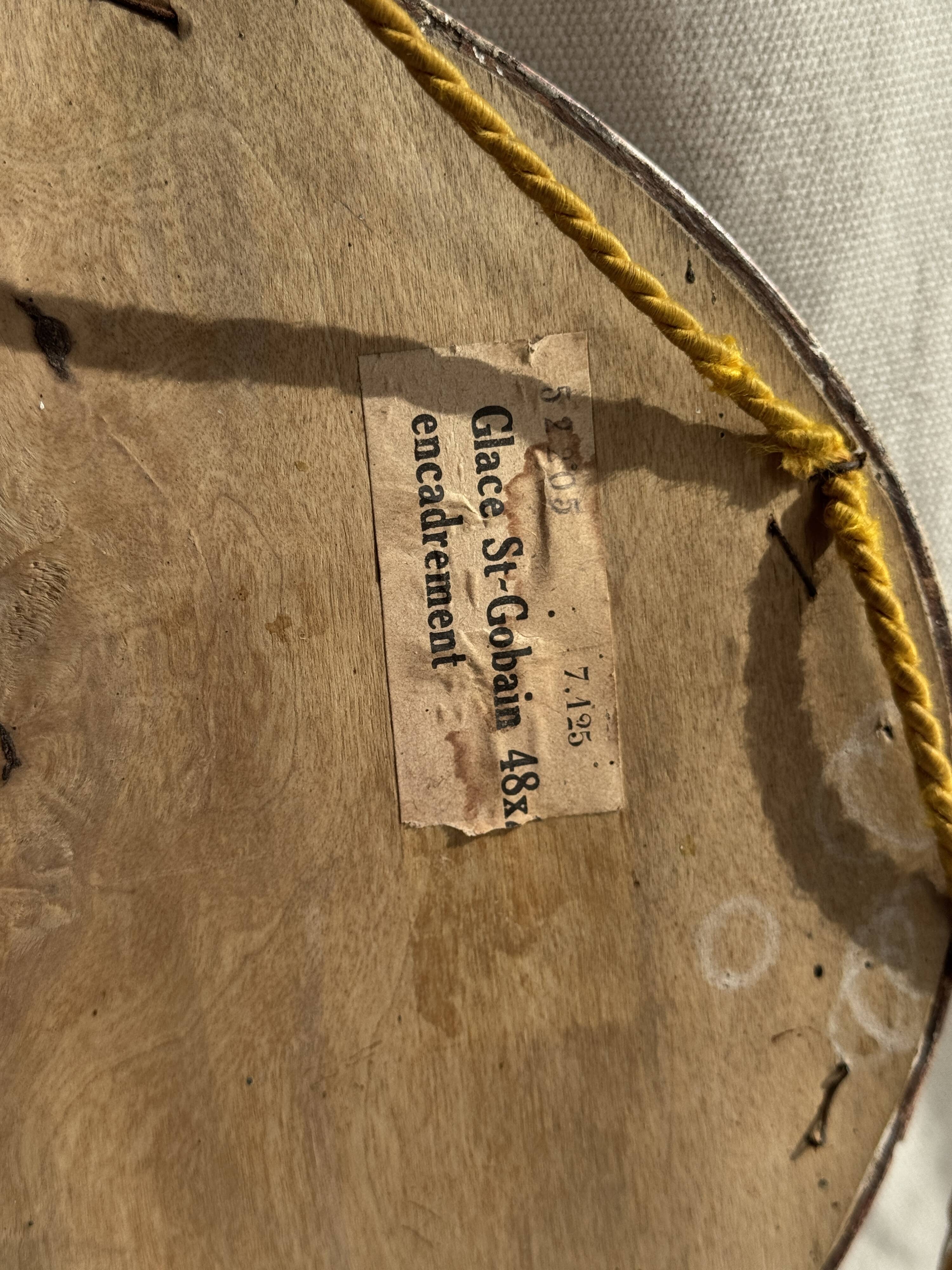 Small oval Art Deco mirror in brown and gold 33x54.