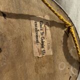 Small oval Art Deco mirror in brown and gold 33x54.