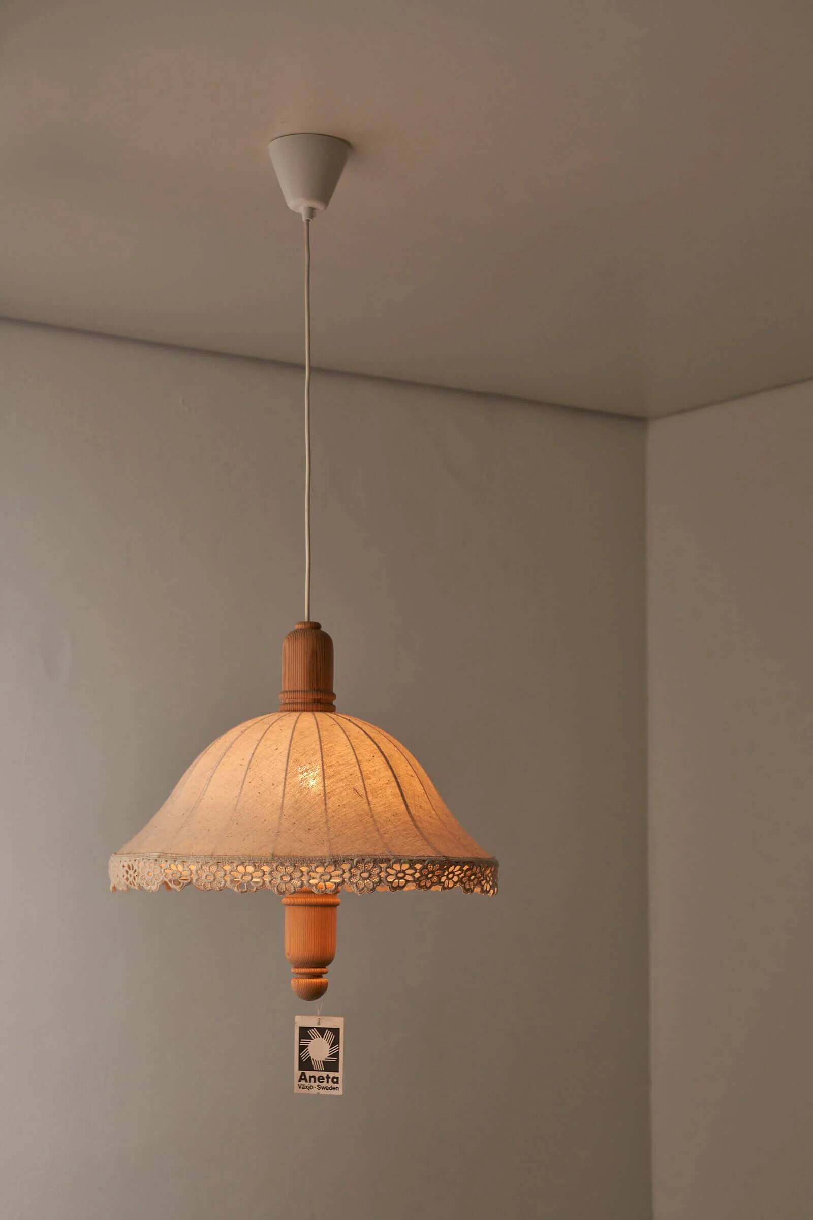 Wood and textile pendant from Sweden