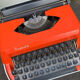 Grey and orange rapido typewriter