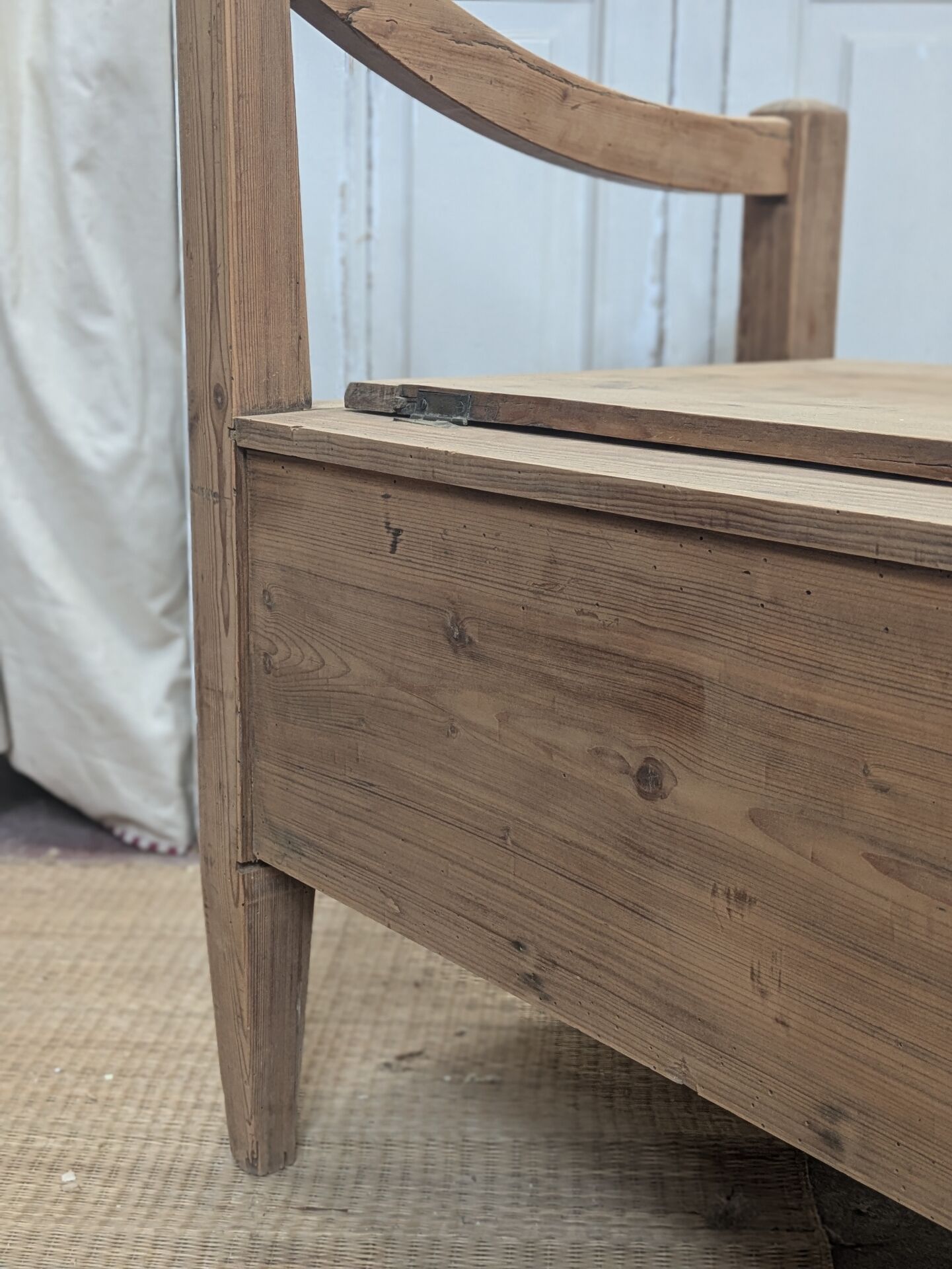 Antique armchair in raw wood