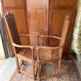 Pair of Renaissance style carved walnut armchairs