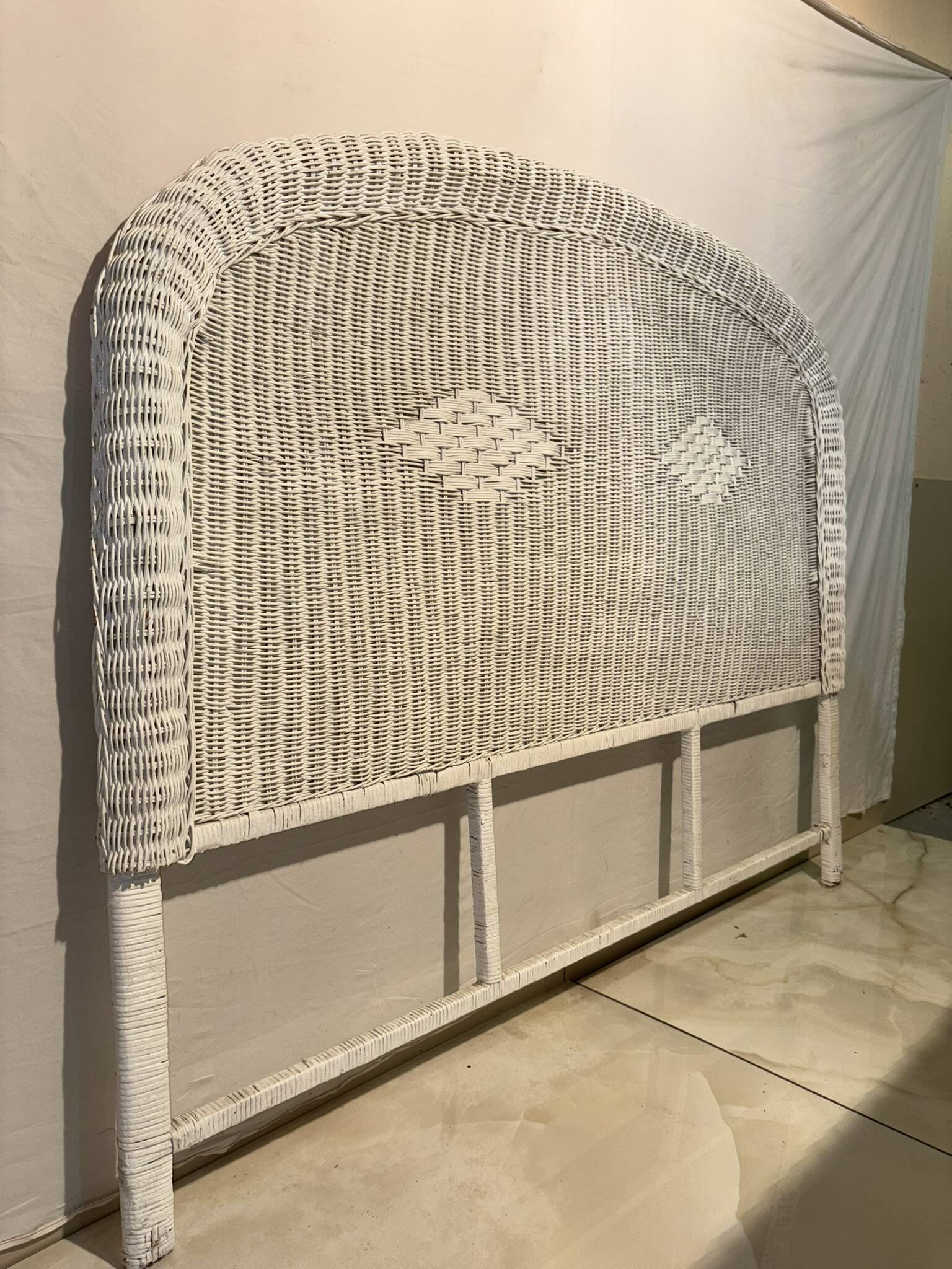 Vintage headboard in woven white rattan