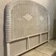 Vintage headboard in woven white rattan