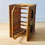 Vintage rattan magazine holder with floral decoration
