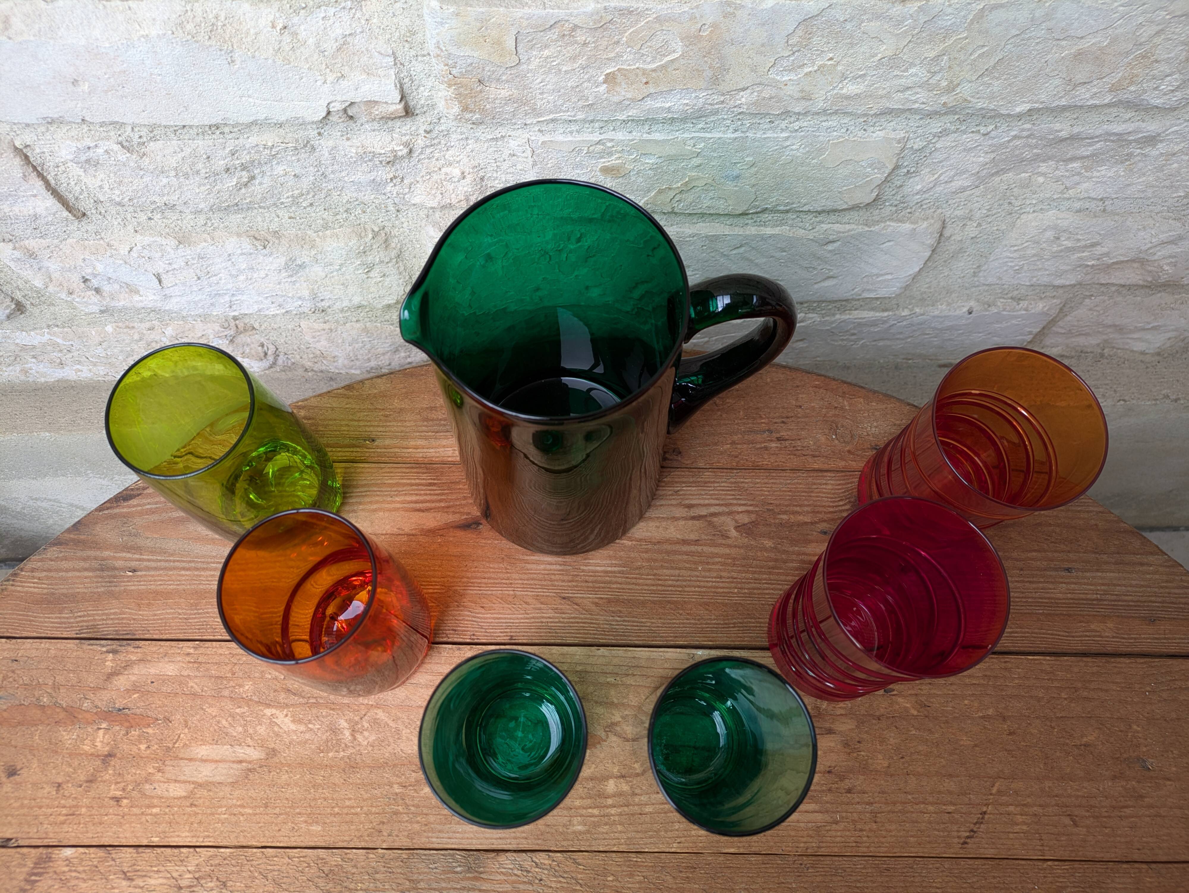 Mismatched colored glass orangeade set with pitcher and 6 glasses