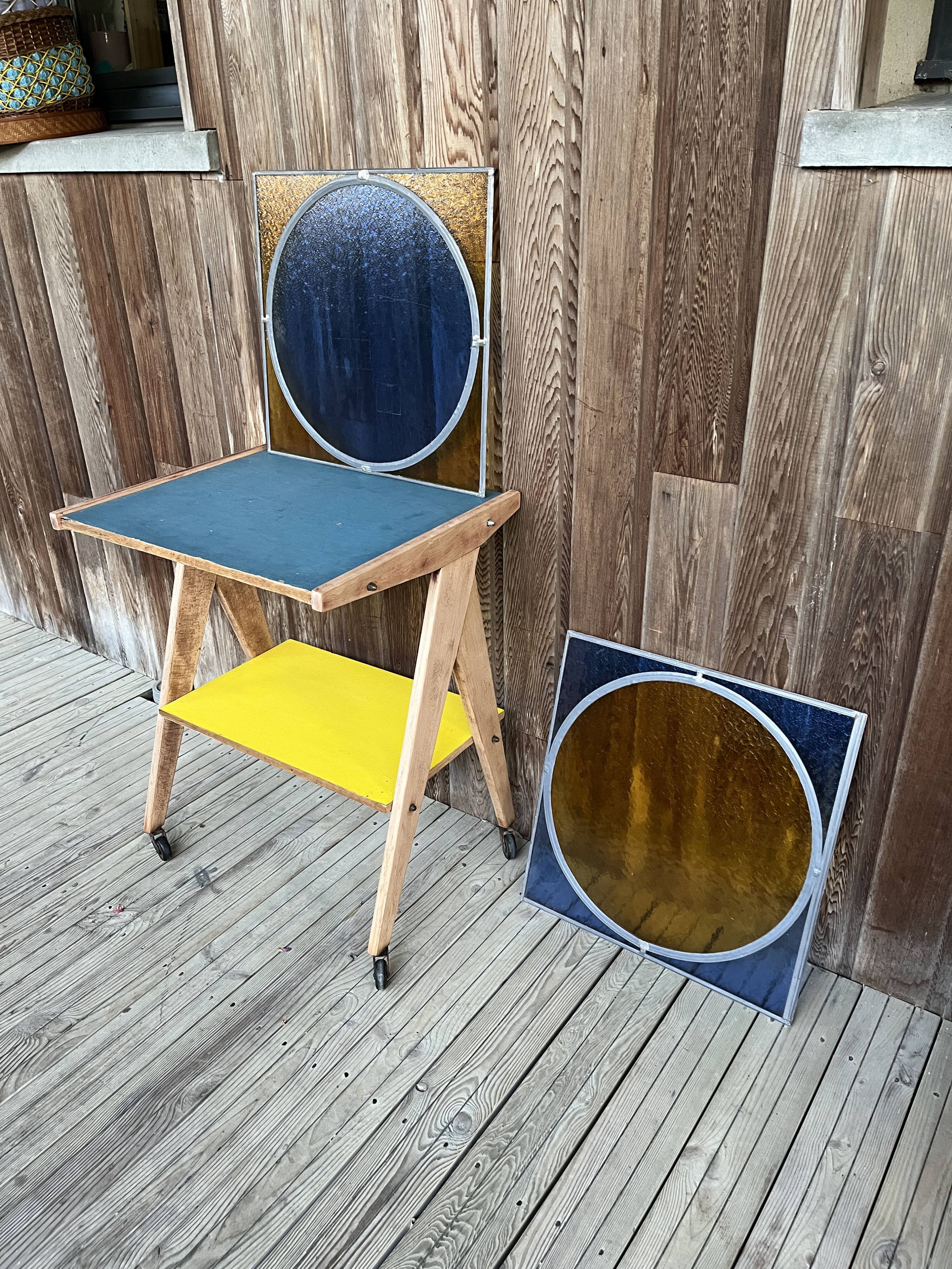 Pair of antique blue and yellow stained glass windows