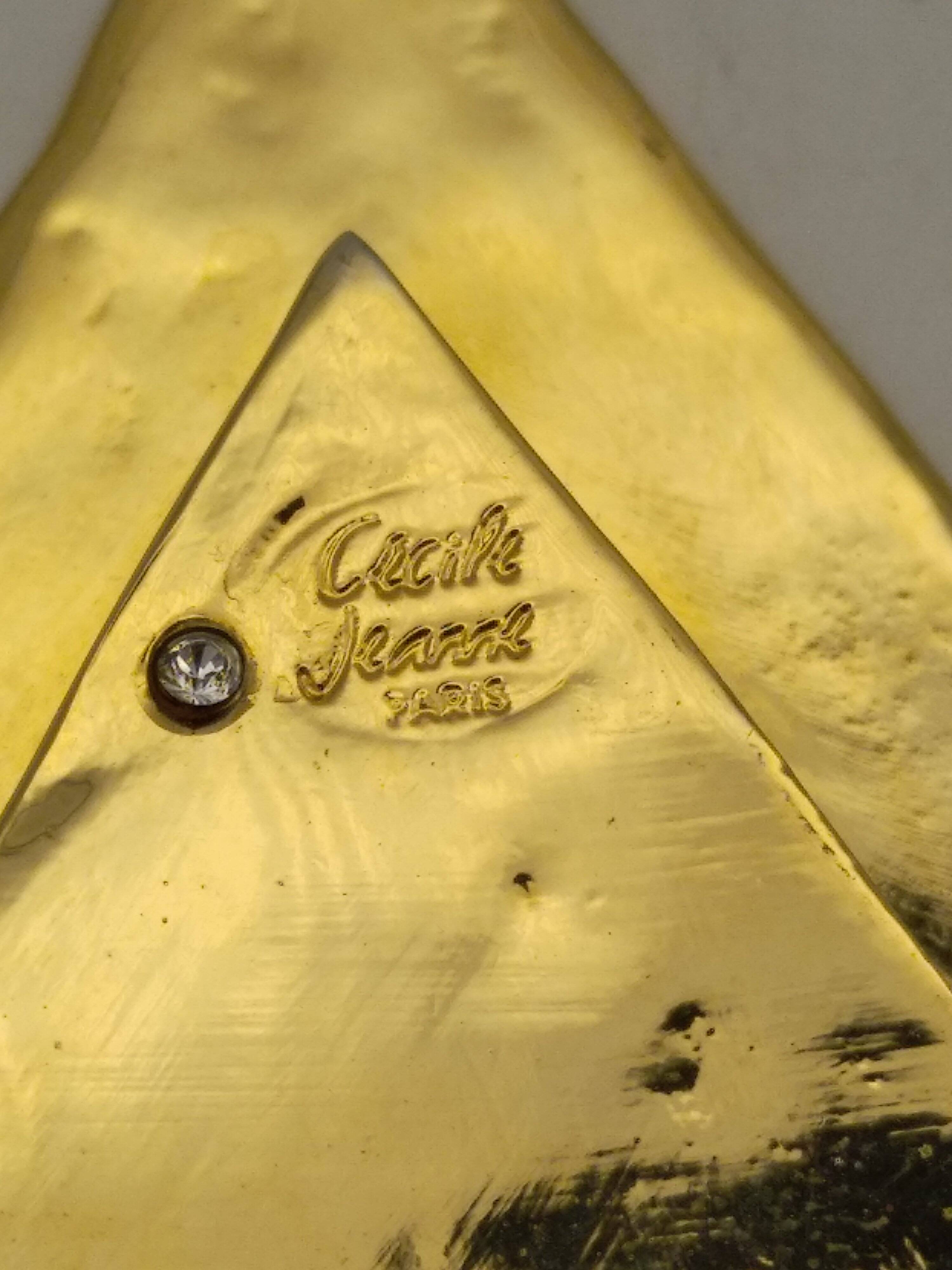 Cecile & jeanne: triangular gold-plated metal pocket tray with hieroglyph decoration.