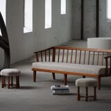 Pair of mid-century Danish oak stools with shearling lambswool upholstery, 1950s.