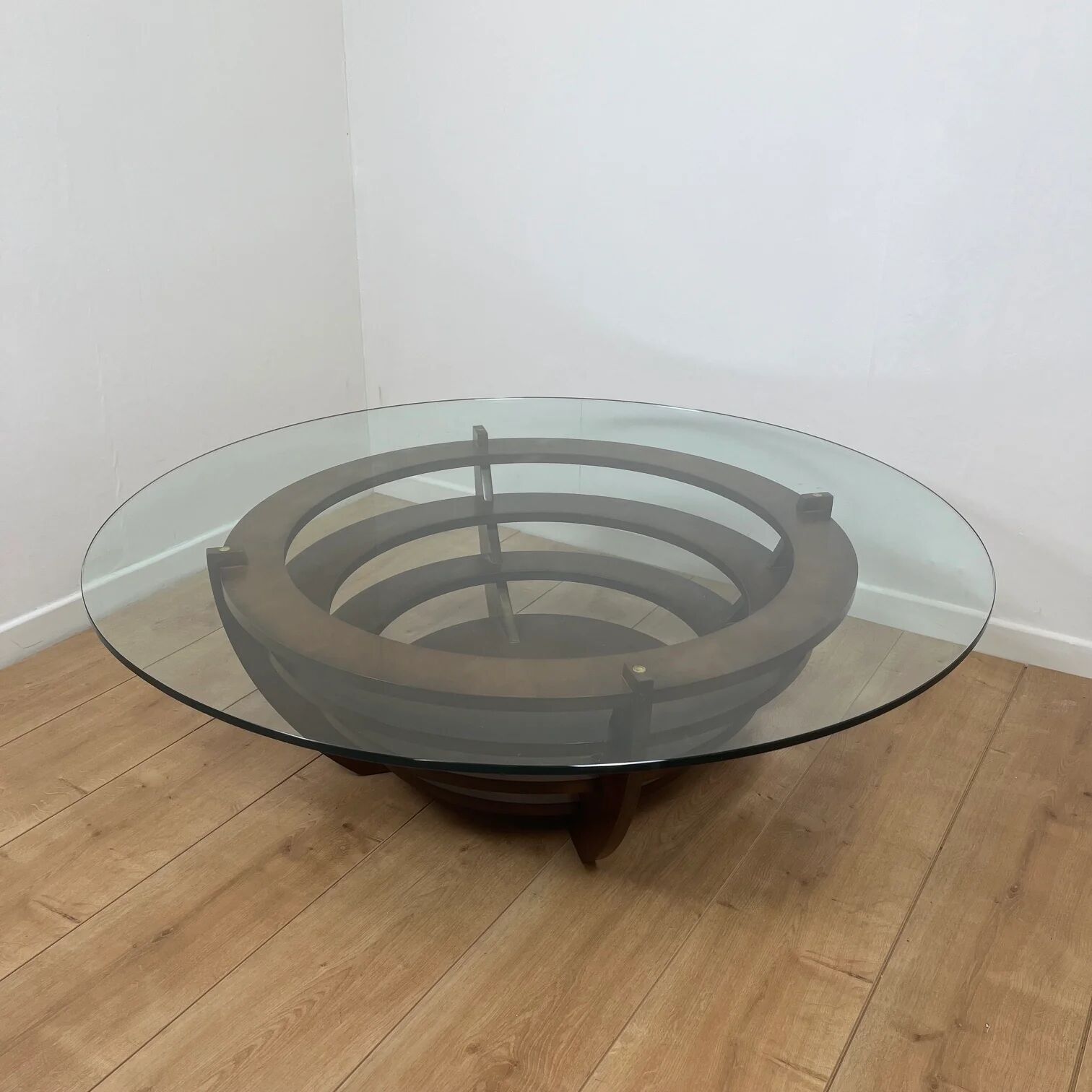 Sculptural coffee table with concentric rings, glass and wood, circa 1985.
