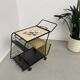 Perforated metal serving trolley in the Mathieu Matégot style