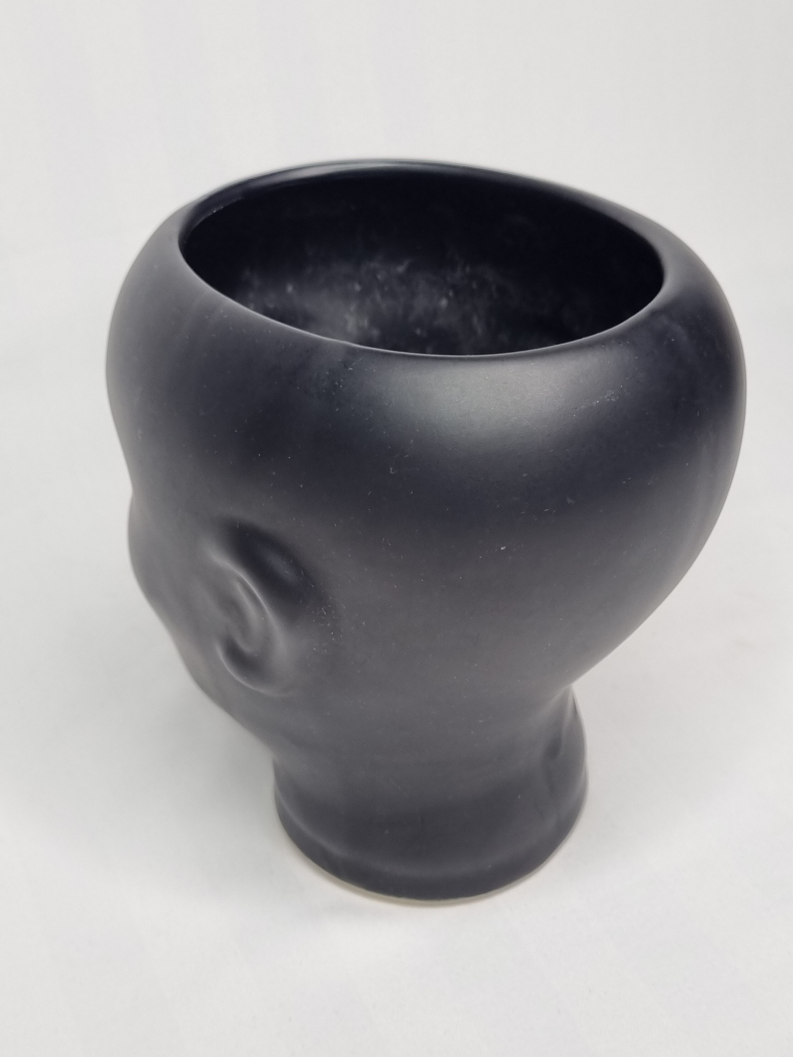 Anthropomorphic pot cover in matt black glazed ceramic, 80s