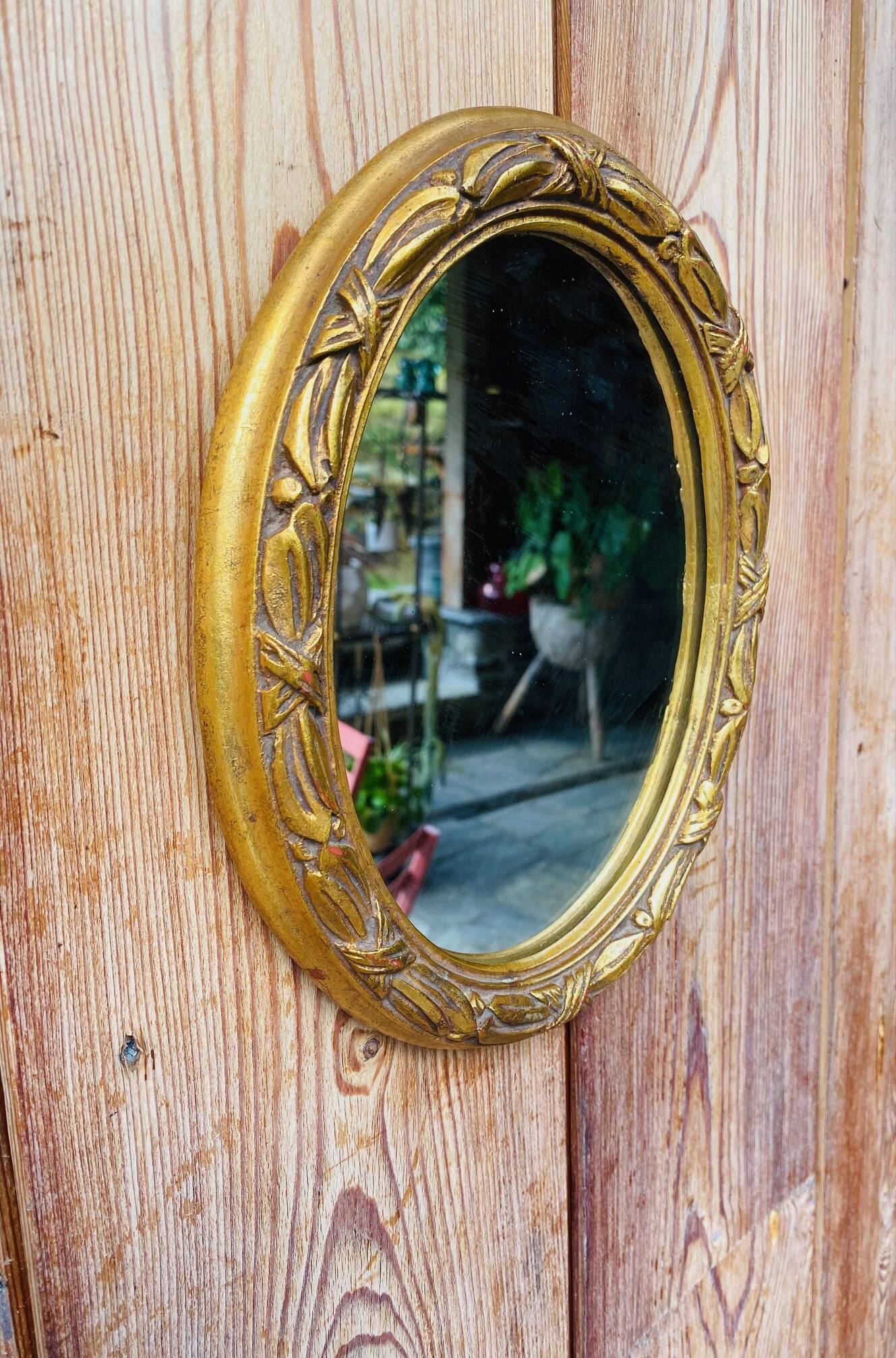 Small antique oval gilt mirror