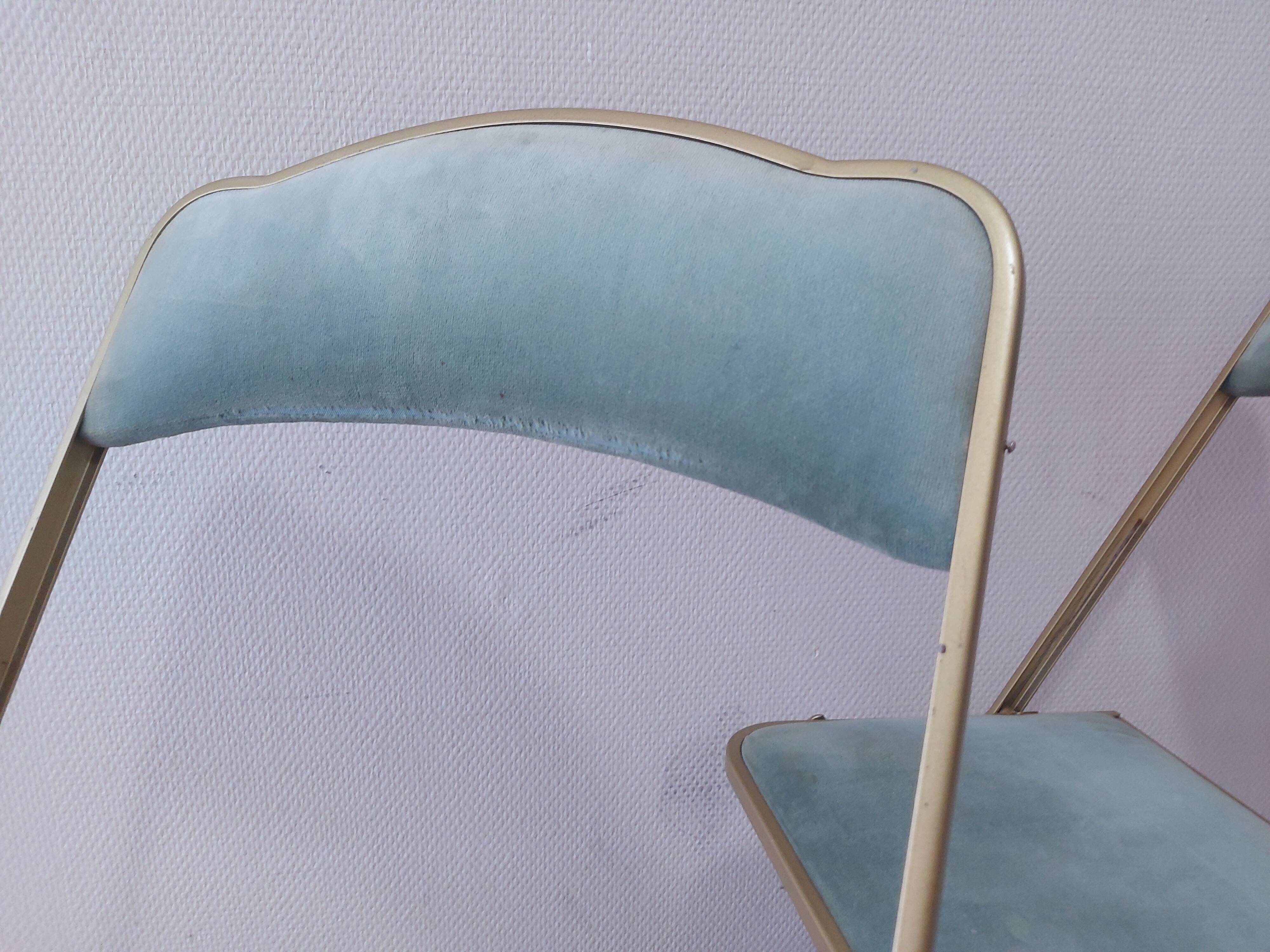 Two folding opera chairs in velvet