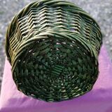 Green wicker basket with a large vintage handle