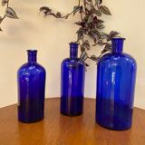 Trio of apothecary bottles in cobalt blue glass