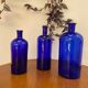 Trio of apothecary bottles in cobalt blue glass