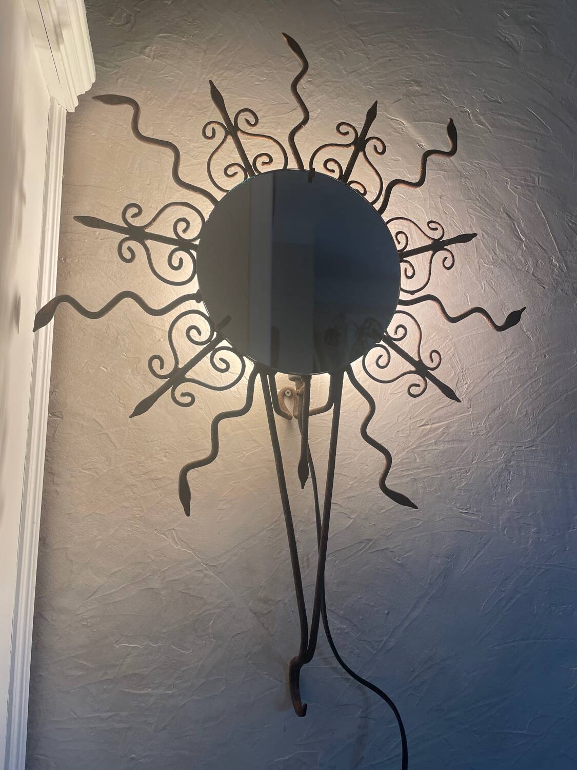 Luminous wrought iron sun mirror