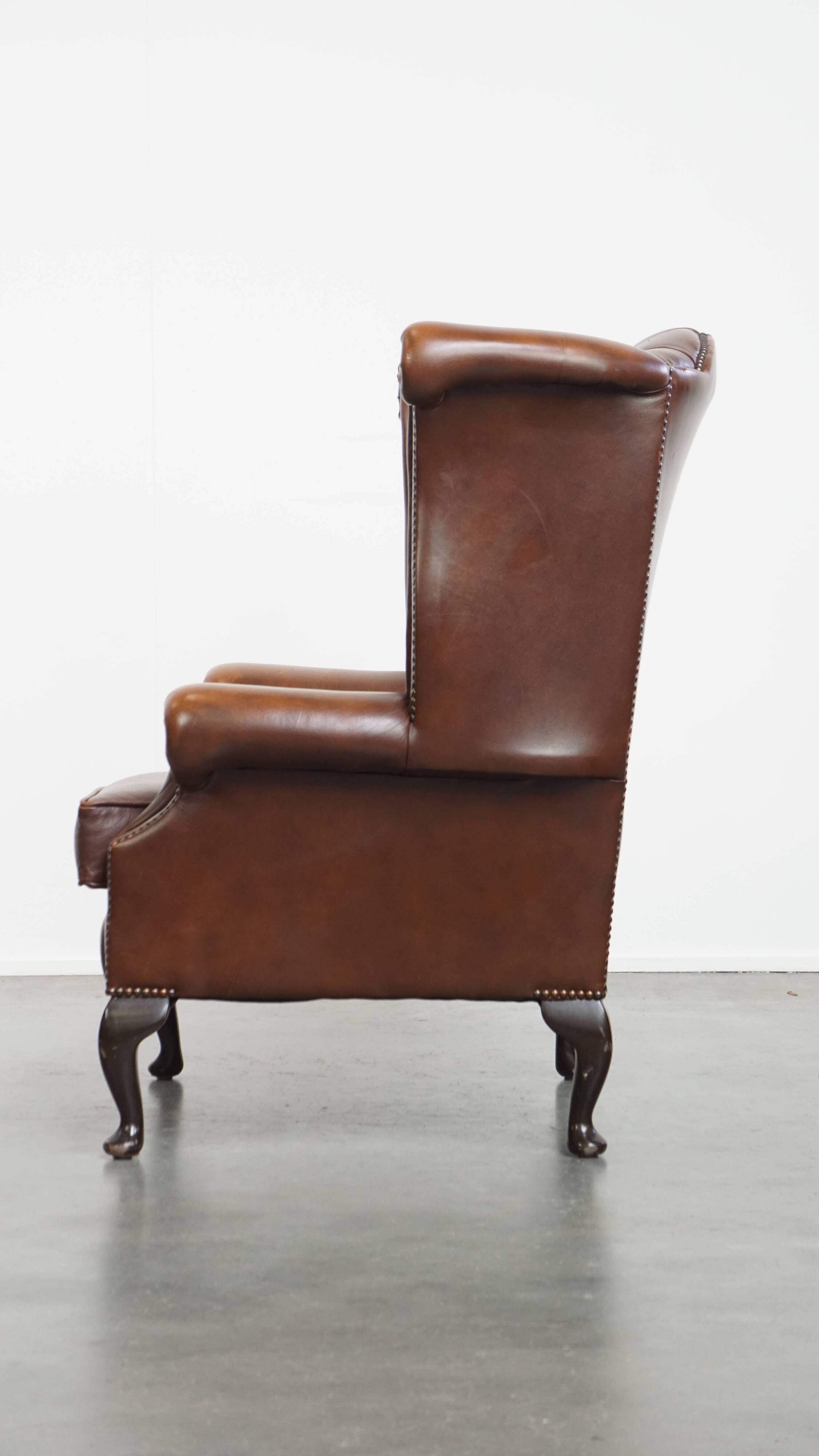Chesterfield wing chair in dark brown English cowhide