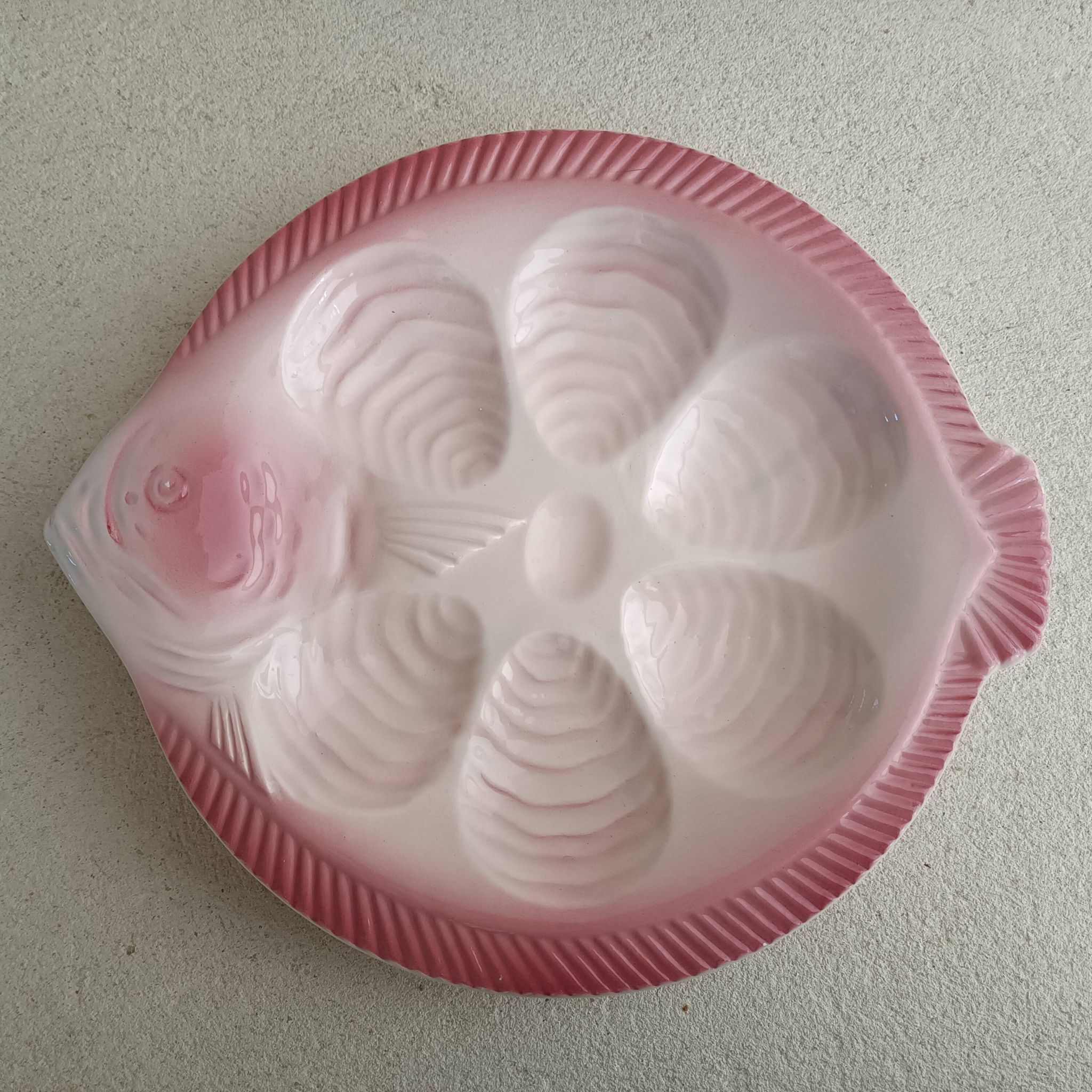 Vintage oyster plates in the shape of a sole.