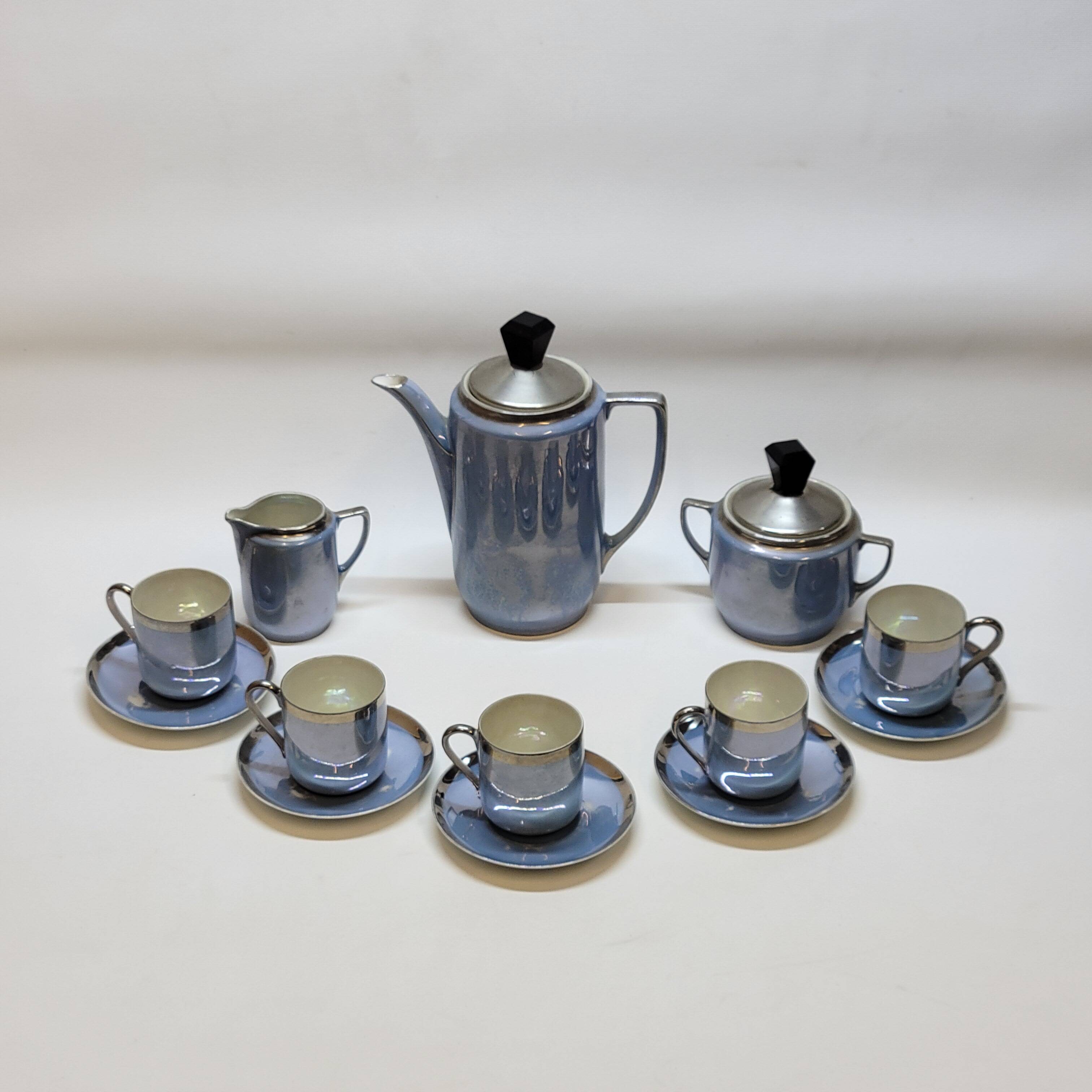 Art deco coffee service in fine iridescent blue porcelain, metal and wood