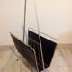 Porte-revue en métal doré et habillage noir / vintage années 60-70