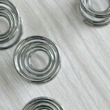 4 stainless steel egg cups.