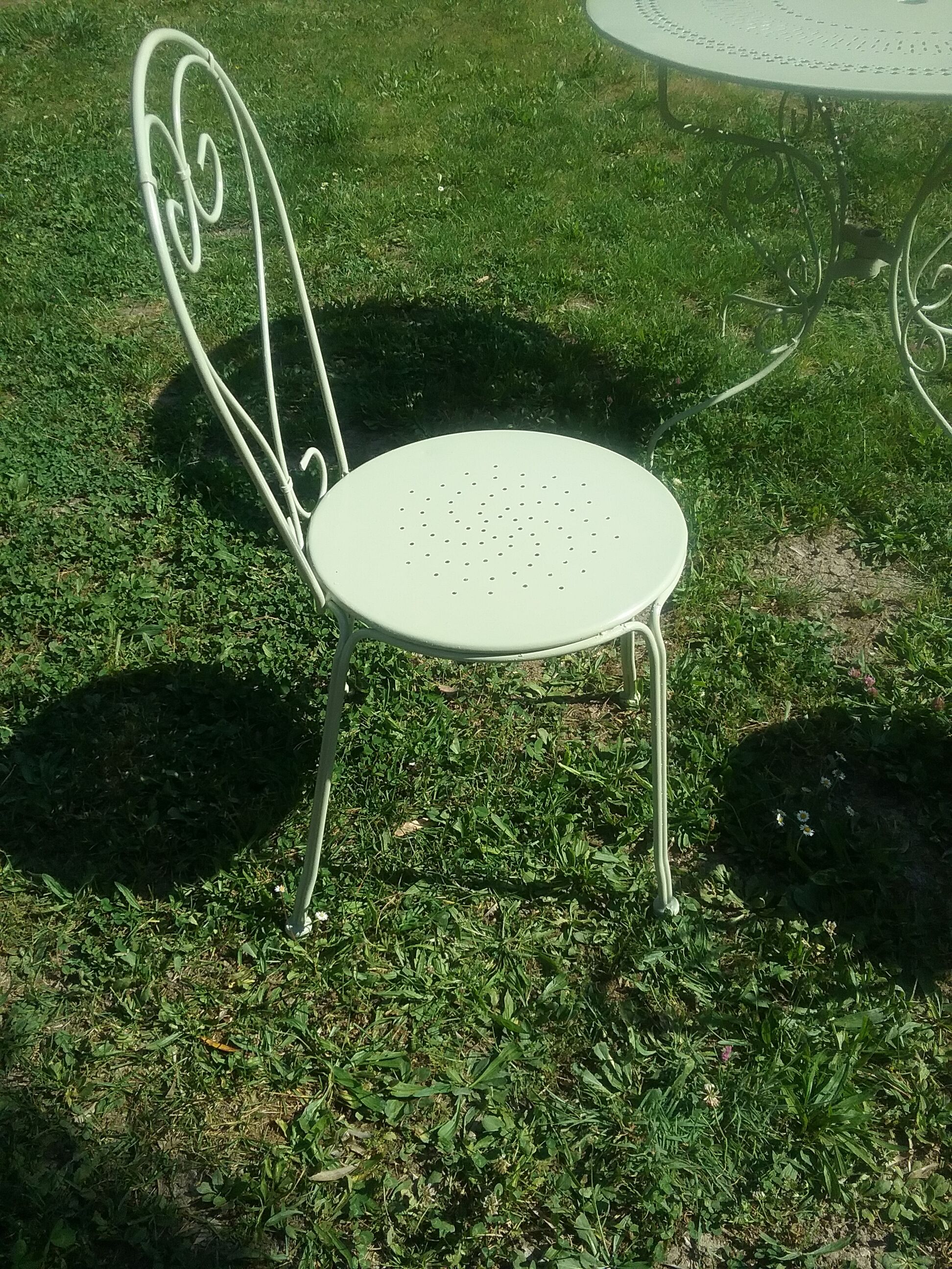 Green wrought iron garden furniture