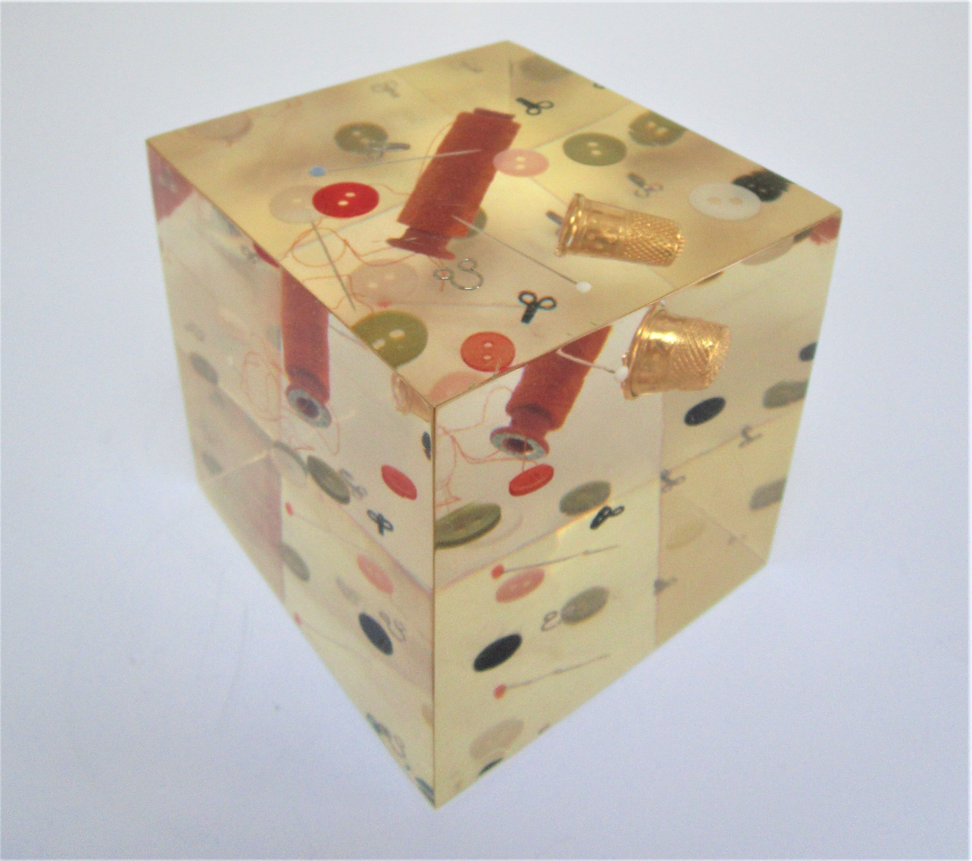 Paperweight sculpture block resin inclusions sewing design 70s