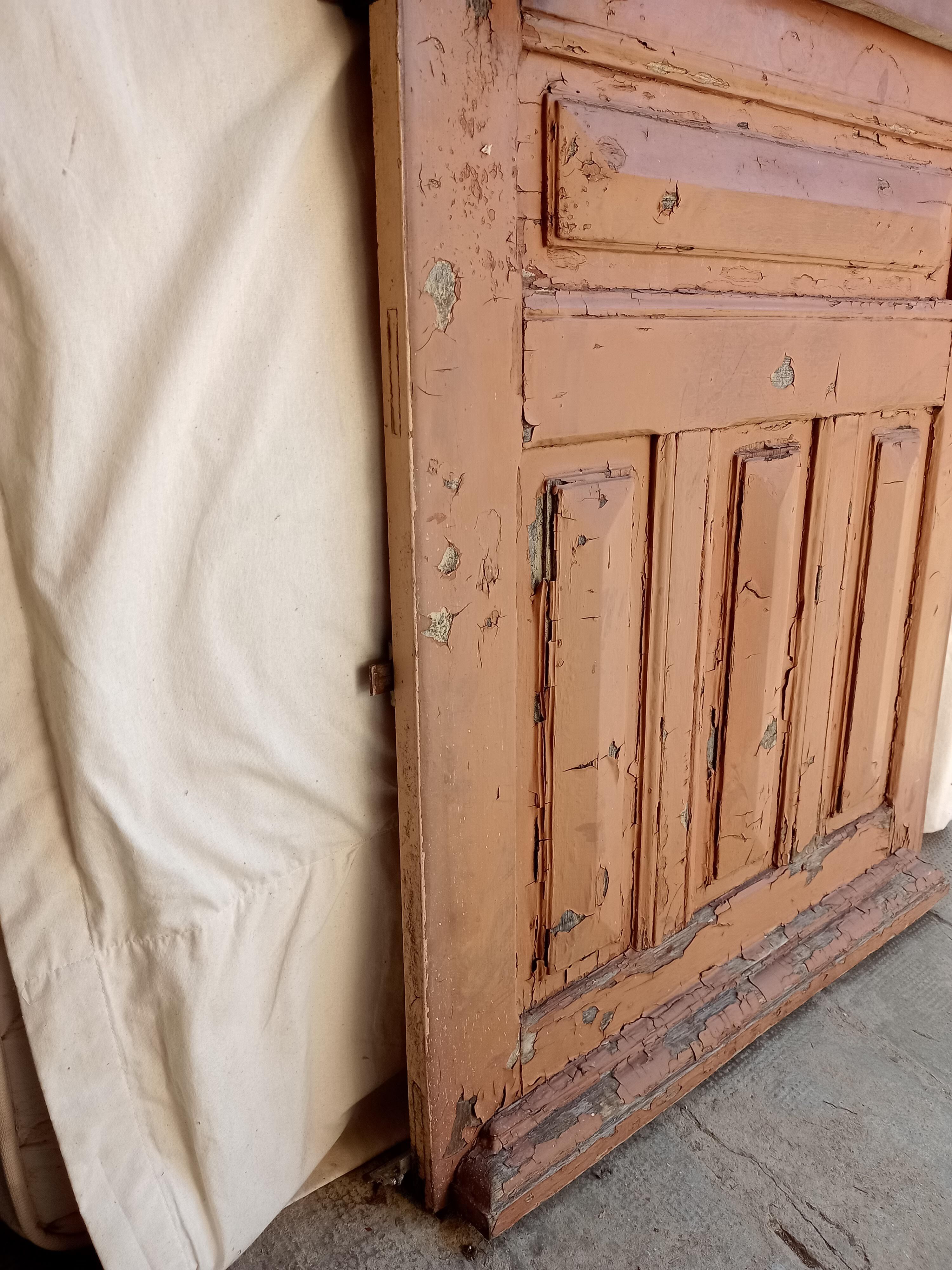 Old glazed door with its shutter