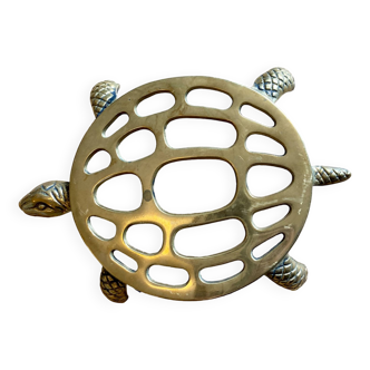 Vintage gold trivet in the shape of a turtle