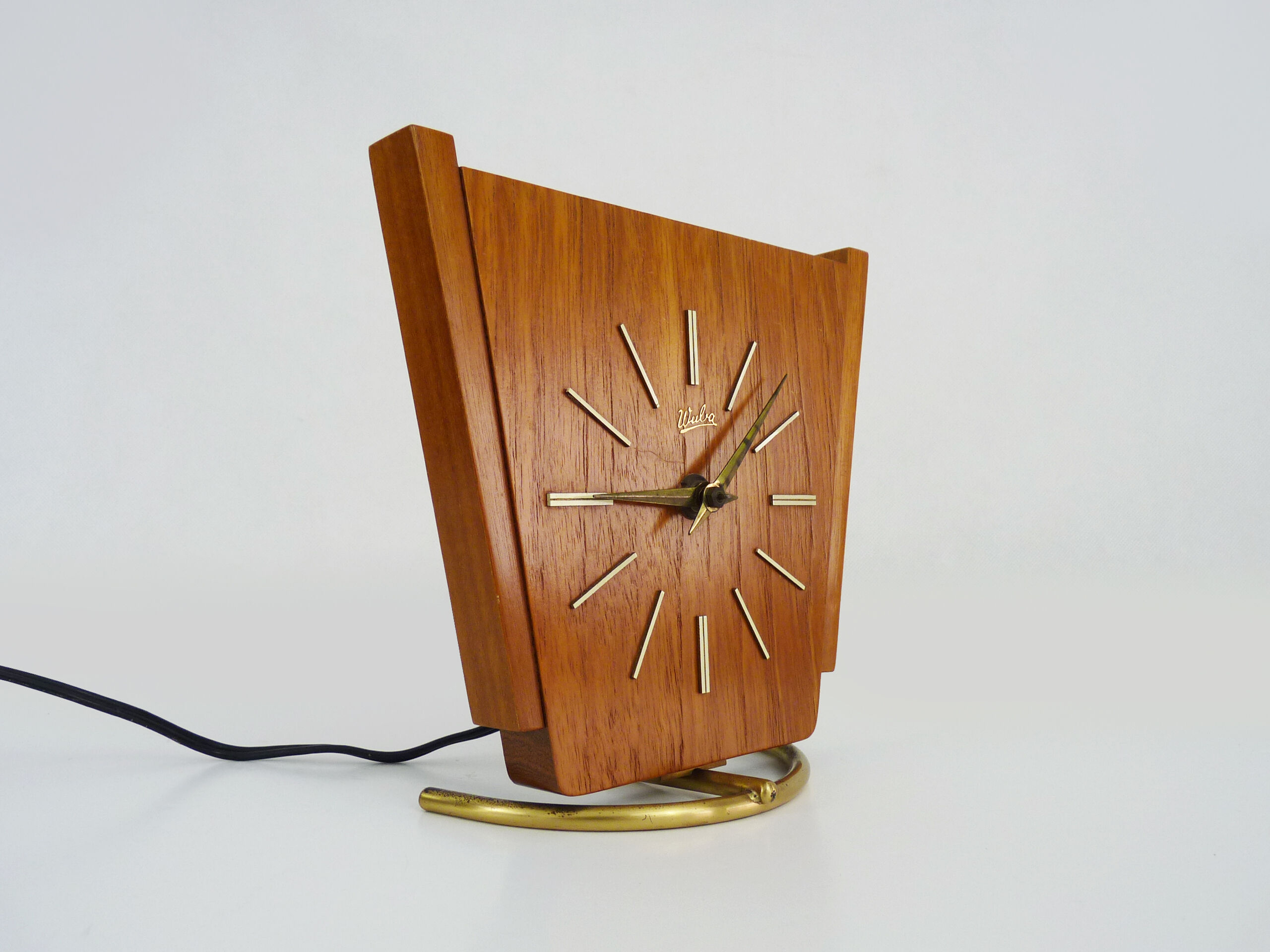 Table clock, art deco clock in Wuba Amsterdam in wood and brass. Year 50