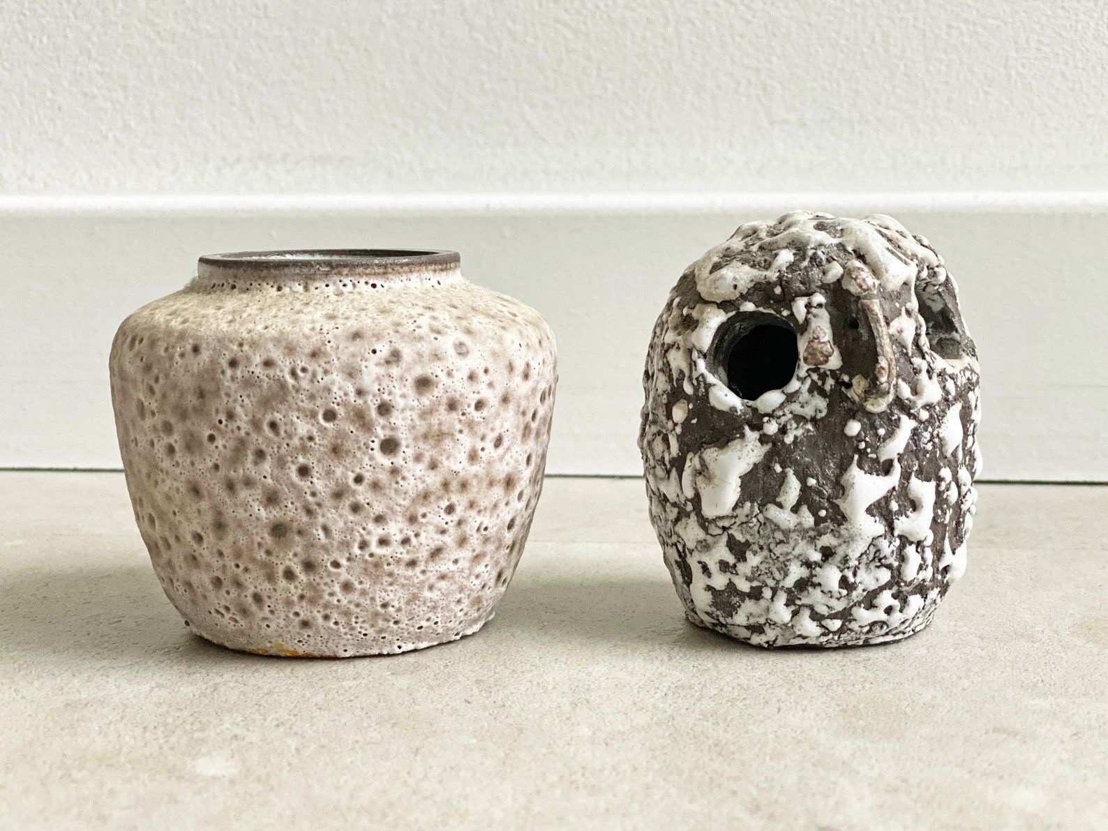 Composition of a small vintage ceramic vase and a ceramic owl figurine / statue