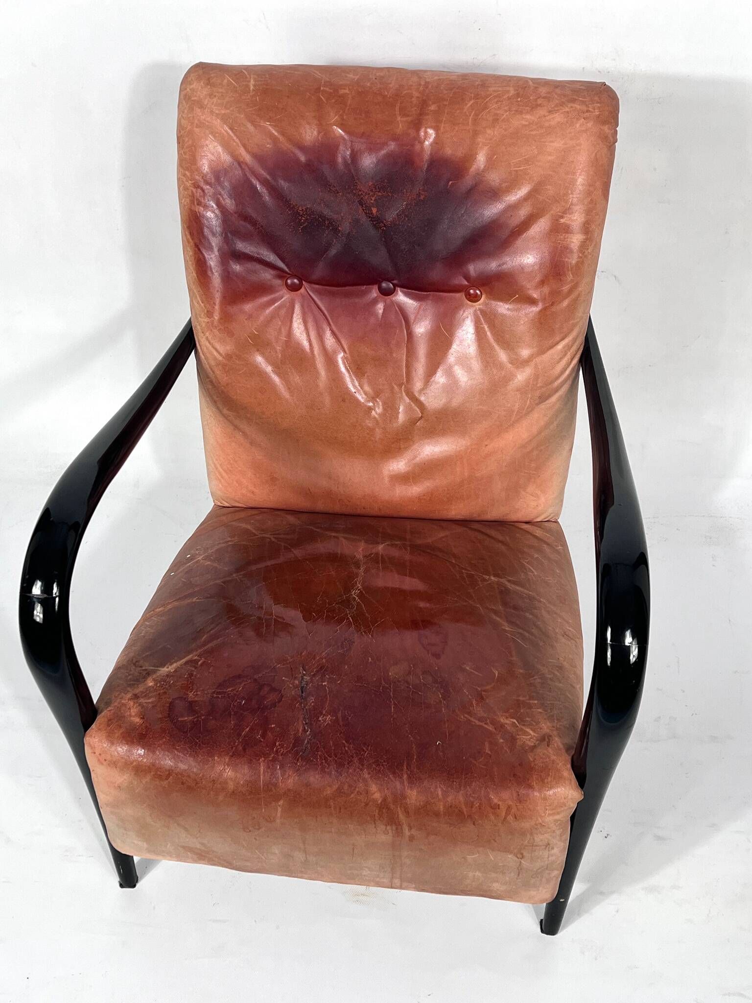 Sculptural Italian Mid-century leather and curved wood armchair from 50s