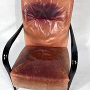 Sculptural Italian Mid-century leather and curved wood armchair from 50s